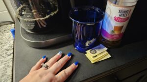 Coffee pot brewing, coffee mug, sweetener