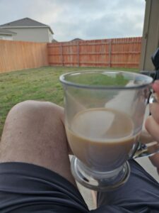 Sitting on the back patio enjoying a cup of coffee. 